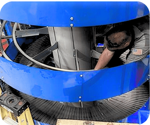 Tech working on spiral conveyor