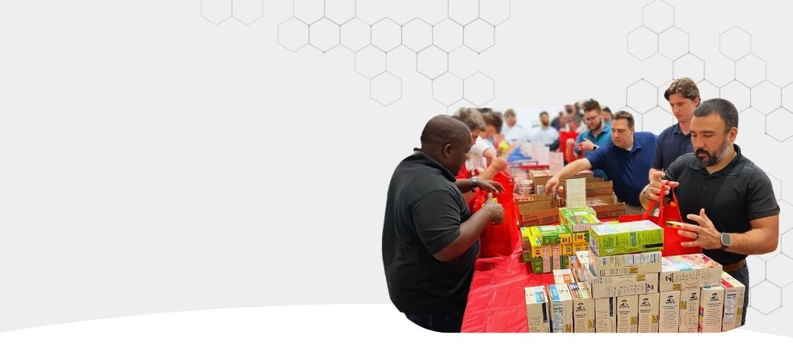 Carolina Handling associates packing food. 