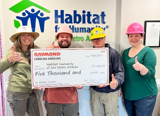 Carolina Handling presents a $5,000 check to Habitat for Humanity of NW Metro Atlanta.