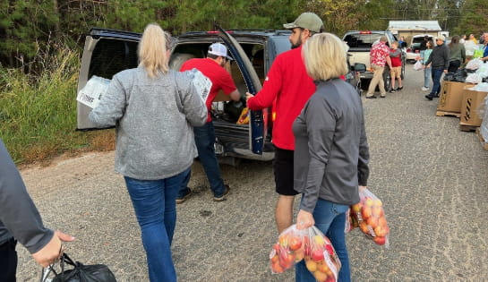 Carolina Handling associates volunteering with food distribution.